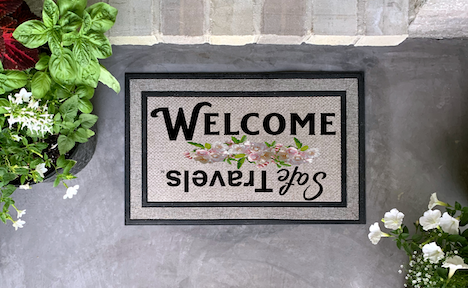 "Welcome Home and Safe Travels" doormat
